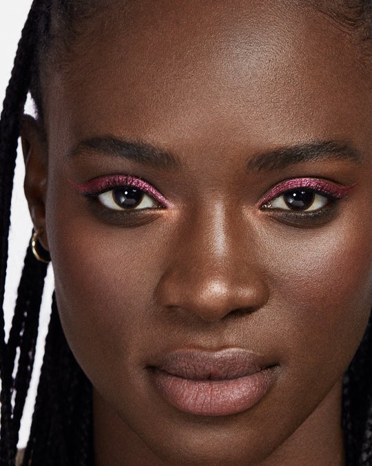 A Violette_FR photo of a model wearing simmering eyeshadow, Yeux Paint in Rose d’Aurore