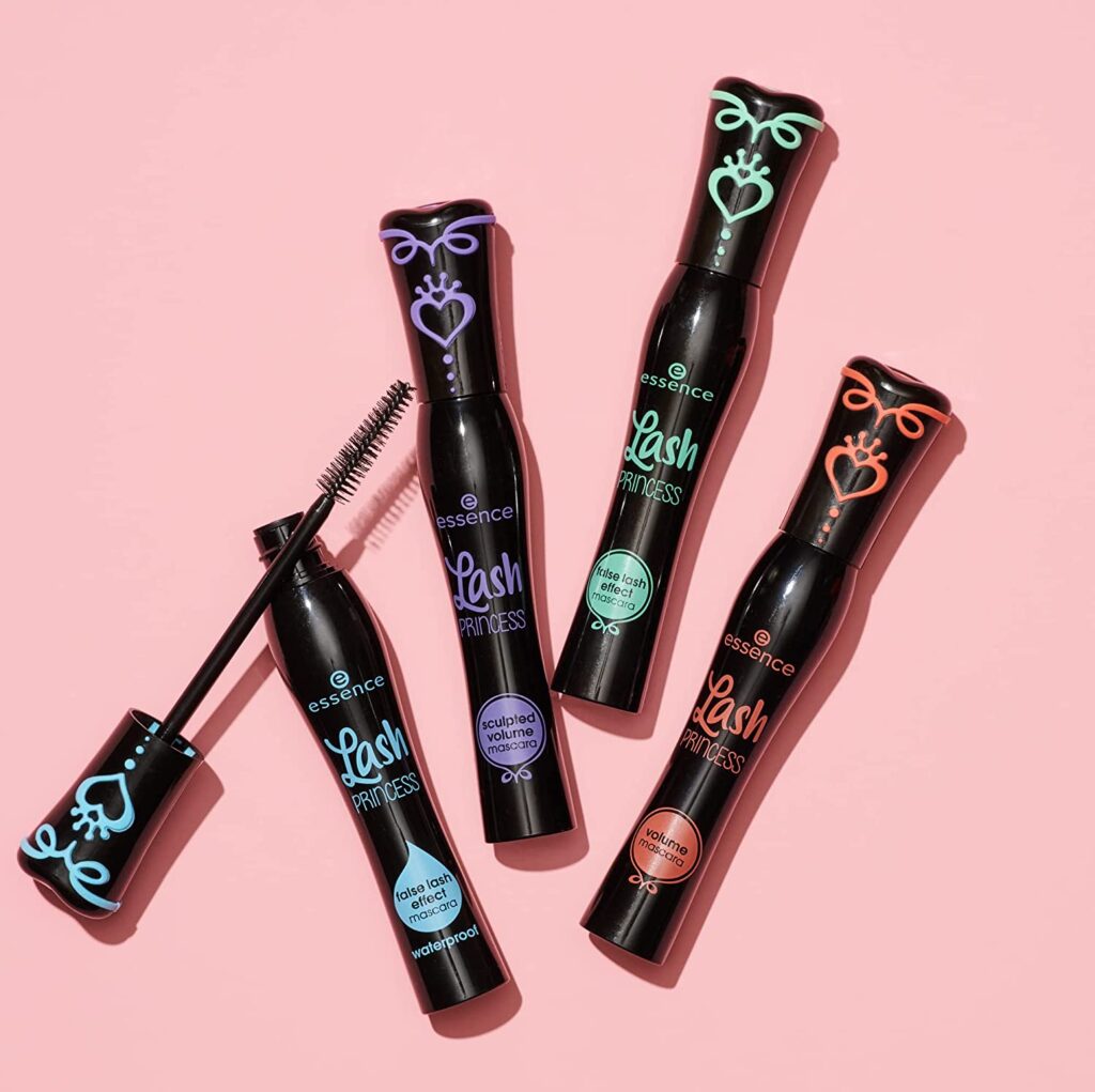 A promotional photo of four different essense lash princess mascara (in the blue, purple, green, and reg colour)