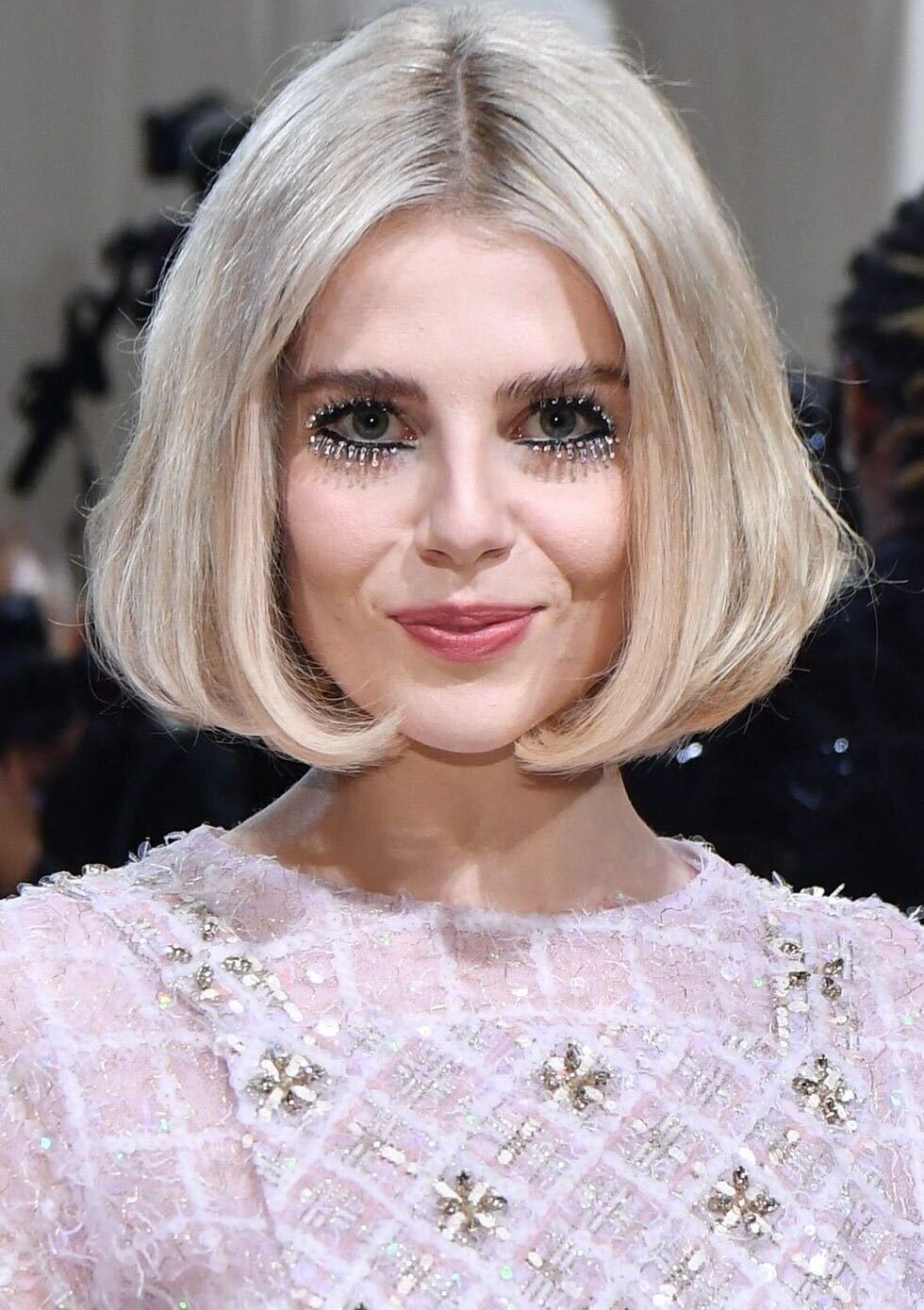 A photo of Lucy Boynton at the MET with rhinestones for eye lashes