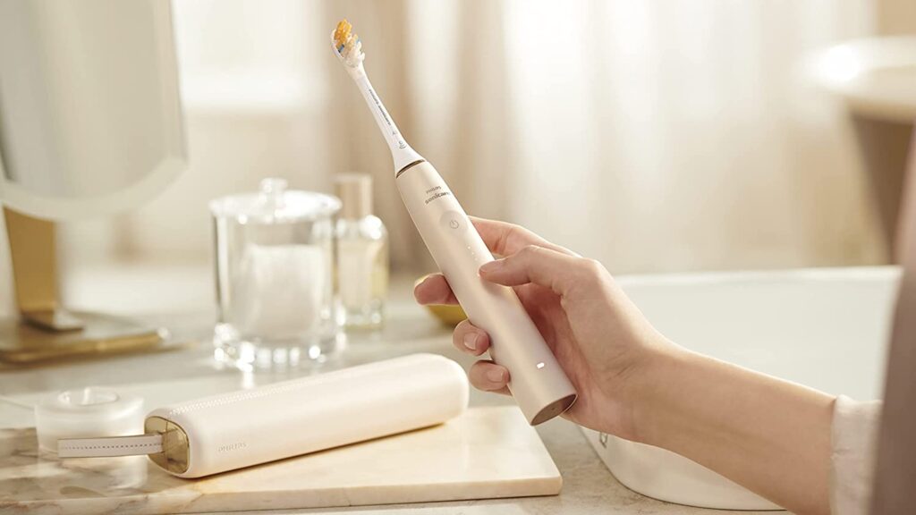 A promotional image of the Phillips 9900 electric toothbrush
