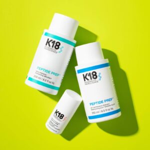 A promotional shot of the K18 products, including two shampoo's and one conditioner