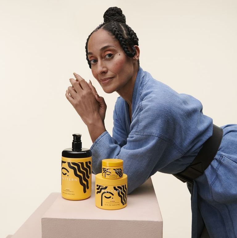 A promotional photo of Tracee Ellis Ross with her hair care line, Pattern Beauty