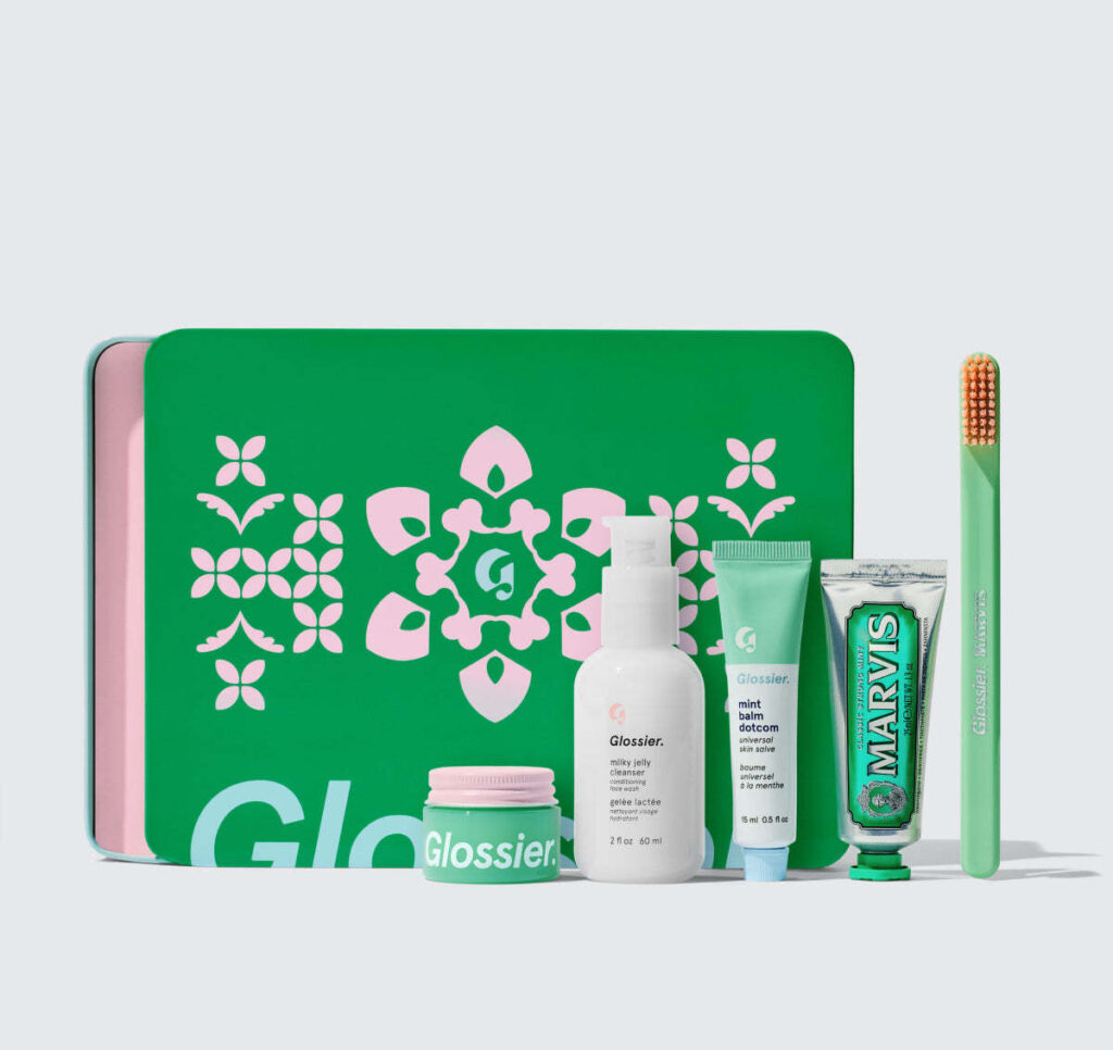 A promotional image of the Glossier x Marvis Cross Country Kit